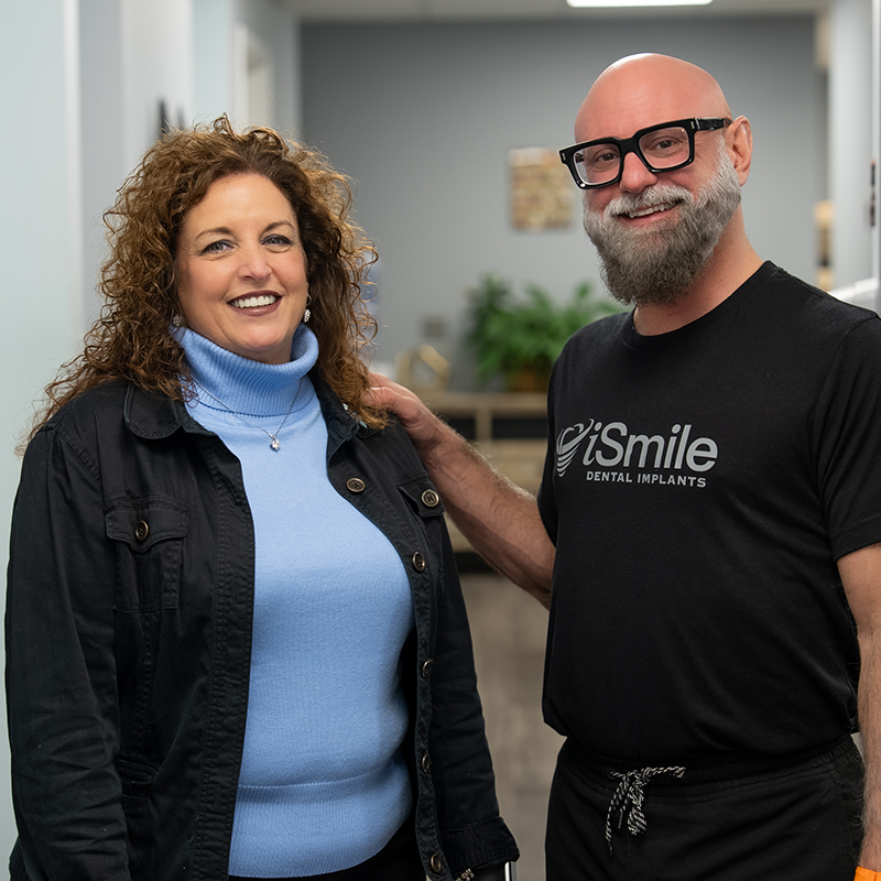 Dr. Hanyon and patient smiling in hallway